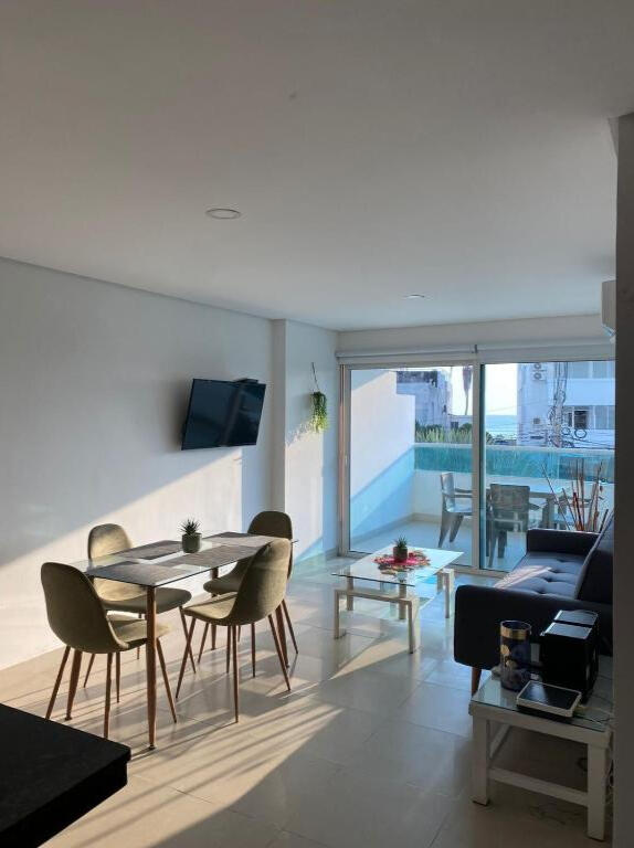 Living and dining area with access to the terrace